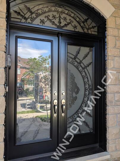 black double doors exterior with forest king full wrought iron glass with extended arch transom lions