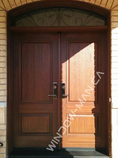 fiberglass exterior front doors double stained in teak with multi point locking system with extended arch transom oak grain